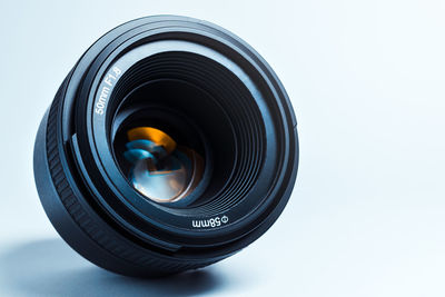 Close-up of camera against white background