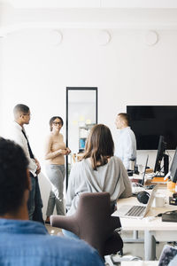 Computer hackers discussing in creative office