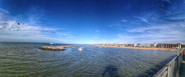 Scenic view of sea against blue sky