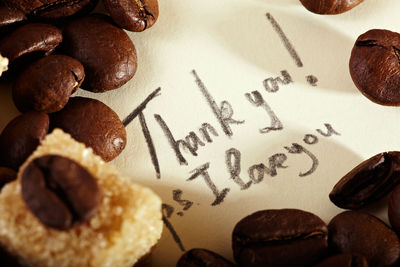 Close-up of text and roasted coffee beans