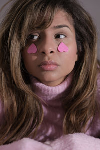 Close-up of young woman with eyes closed