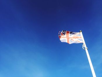 Torn british flag flying in wind