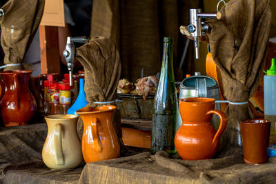 Beer taps by jugs on table