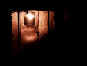 Close-up of illuminated electric lamp