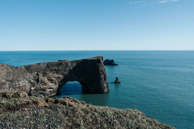 Scenic view of sea against clear blue sky