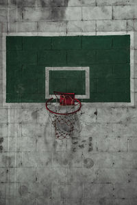 Basketball hoop against wall