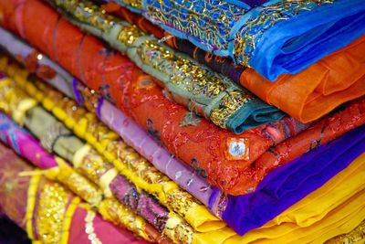 Close-up of patterned blankets stacked for sale