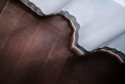 High angle view of man relaxing on wood