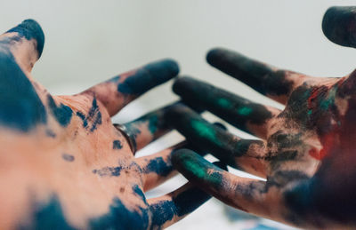 Close-up of hands with powder paint