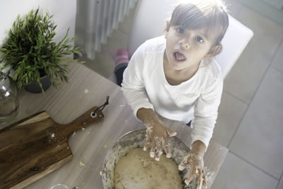 High angle portrait of woman at home