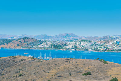 Scenic view of sea against clear blue sky