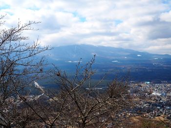 Scenic view of tree mountains against sky