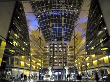 Low angle view of illuminated modern building