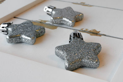 Close-up of star shape glitter decorations on table