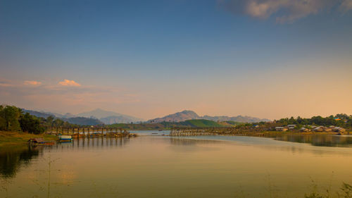 Scenic view of lake against sky during sunset