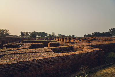 Built structure on field against clear sky