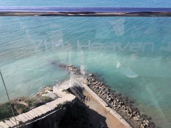 High angle view of swimming pool by sea