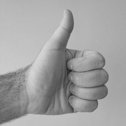 Close-up of human hand against white background