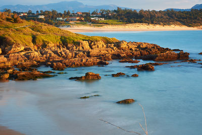 Scenic view of sea and rocks against sky