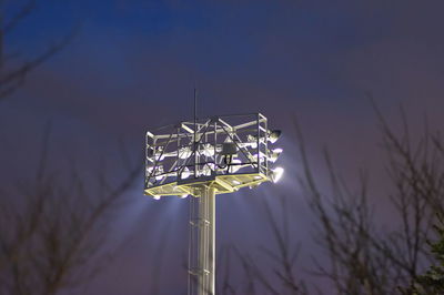 Low angle view of illuminated lights against sky