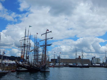 Boats moored at harbor