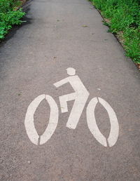 High angle view of arrow sign on road