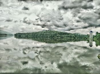 Scenic view of landscape against cloudy sky