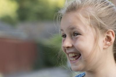 Close-up portrait of smiling girl