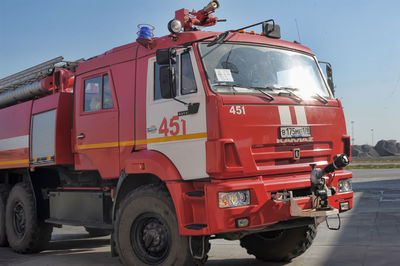 View of red vehicles on road