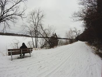 Snow covered landscape against sky