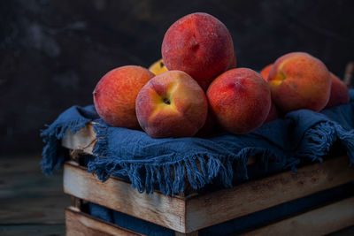 Close-up of apples in basket on table