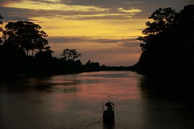 Scenic view of lake at sunset