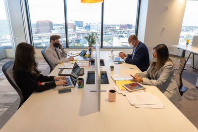 Group of people working on table