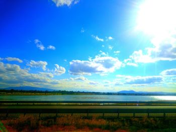 Scenic view of landscape against cloudy sky