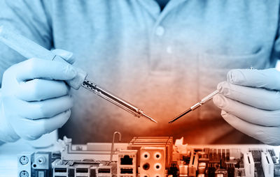 Close-up of engineer repairing circuit board