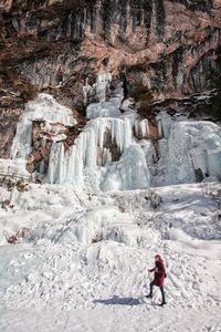 Full length of person on rock in mountains