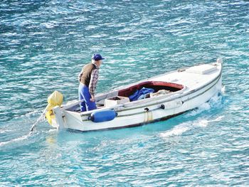 High angle view of young woman in sea