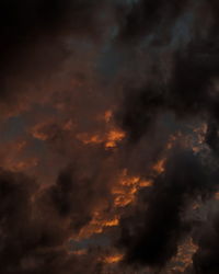 Low angle view of dramatic sky during sunset