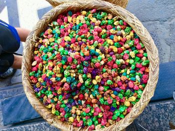 High angle view of colorful candies in basket