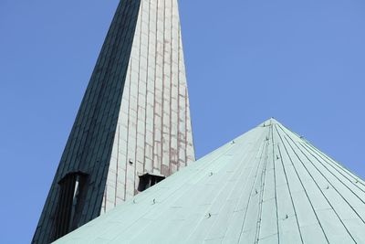 Low angle view of modern building against clear blue sky