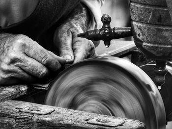 Midsection of man working in factory