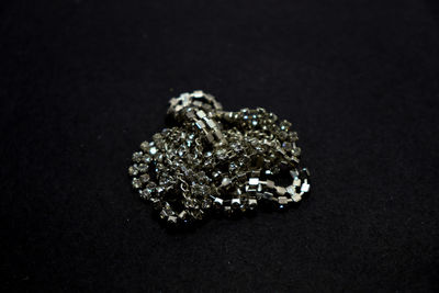 Close-up of ring on black background