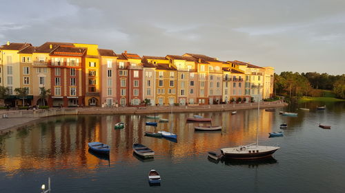 Boats in canal with buildings in background