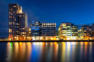 Illuminated buildings in city at night