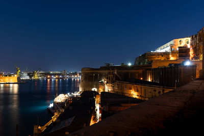 Illuminated buildings in city at night