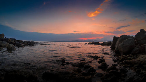 Scenic view of sea against sky during sunset