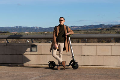 Young bussinesman on his work break time on sustainable and healthy lifestyle using electric scooter