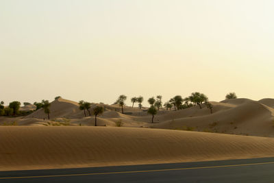 Scenic view of desert against clear sky