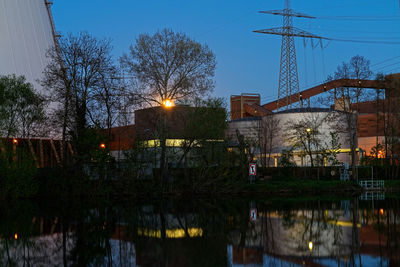 Panoramic view of illuminated city against sky at dusk