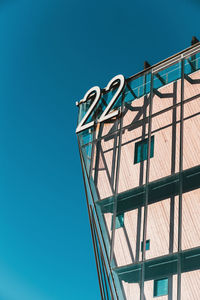 Low angle view of building against clear blue sky